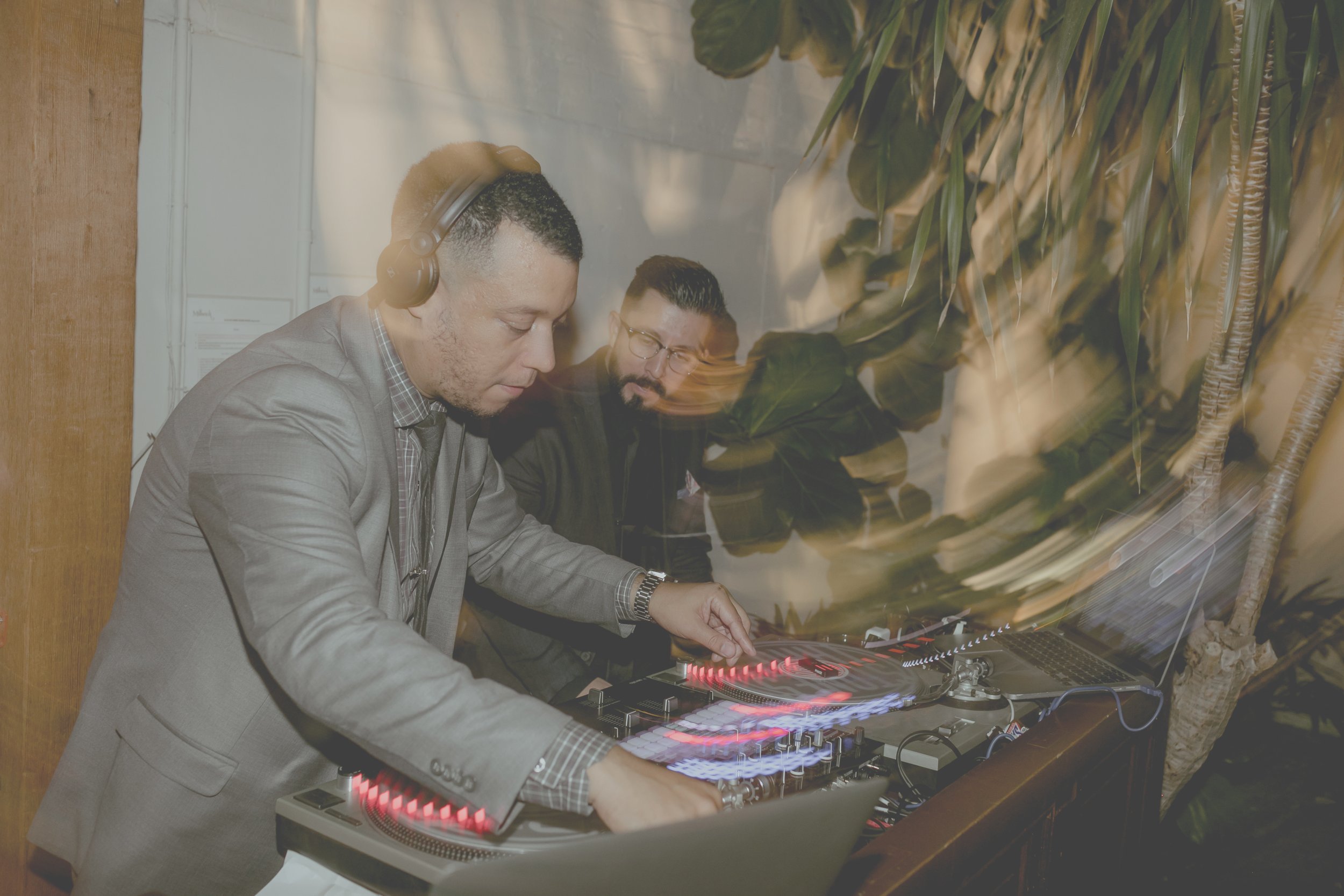 Ricardo and Adrian mixing records together at an event